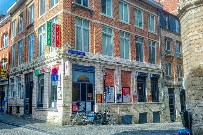 600 Years of History and Heritage: A Self-Guided Walking Tour of Leuven - Oude Markt energy: competing squares, chapels, and famous statues