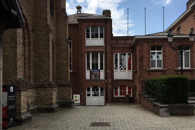 Bruges’ Legends and Hidden Treasures: A Self-Guided Audio Tour - Church of Our Lady, St Bonifacius Bridge, and Groeningemuseum Pass-By