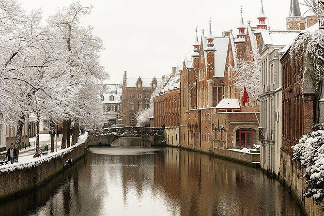 Bruges Uncovered: Historic Walking Tour & Canal Boat Experience - Walking Past Museums and Squares Toward the Canal World