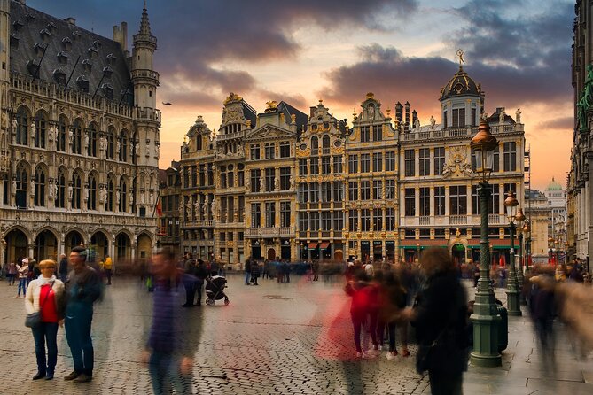 Brussels Walking Tour with Waffle Tasting: History and Delights - Town Hall tower details: Archangel Michael, Gothic drama, and symbolism